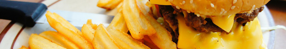 Eating Burger at Grub Burger Bar restaurant in Dallas, TX.